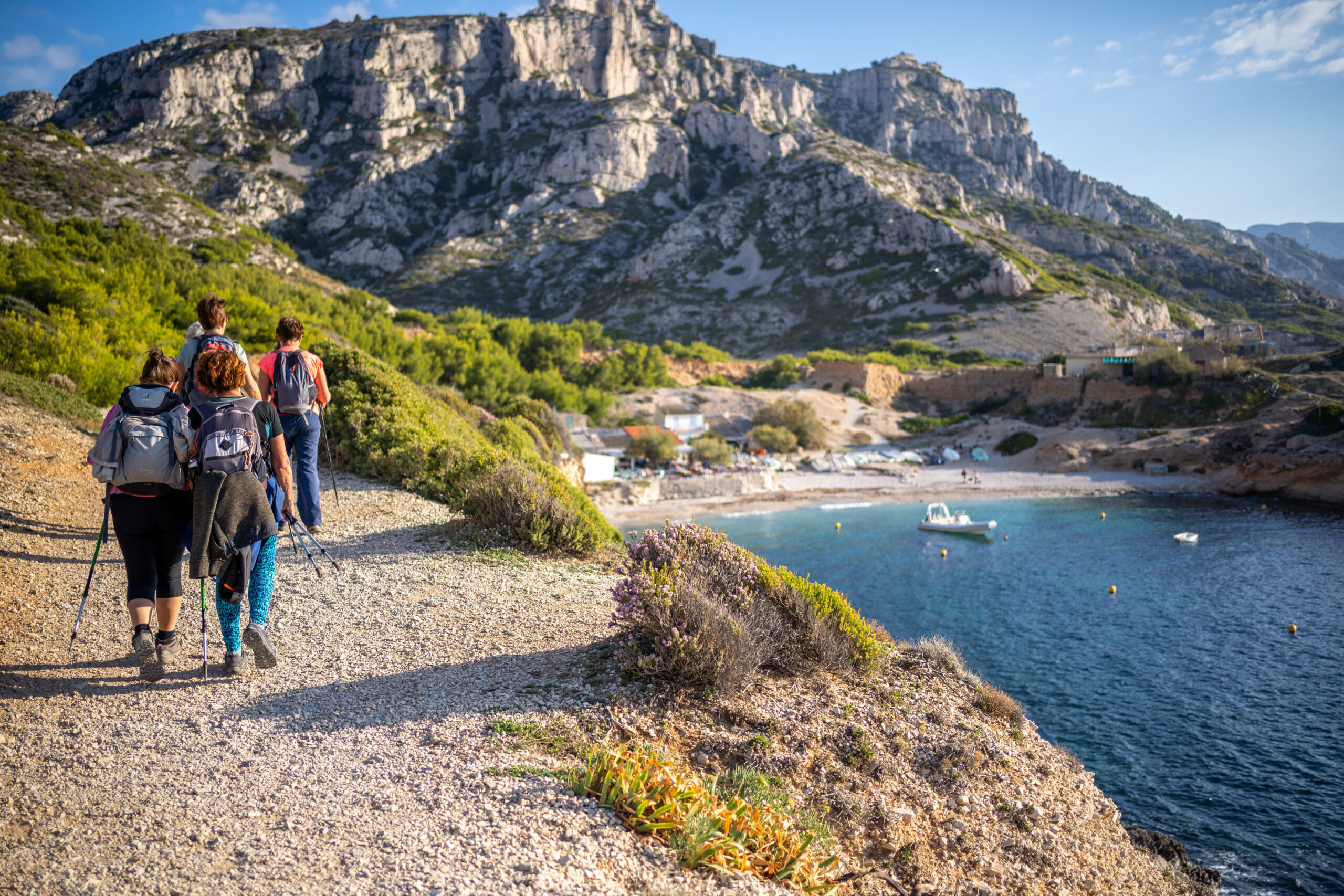 Couple hiking a rugged Mediterranean coastline