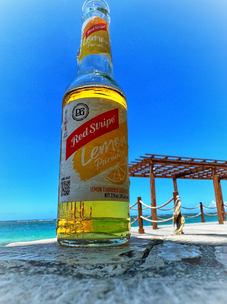 Ice-cold Red Stripe beer on a Caribbean beach