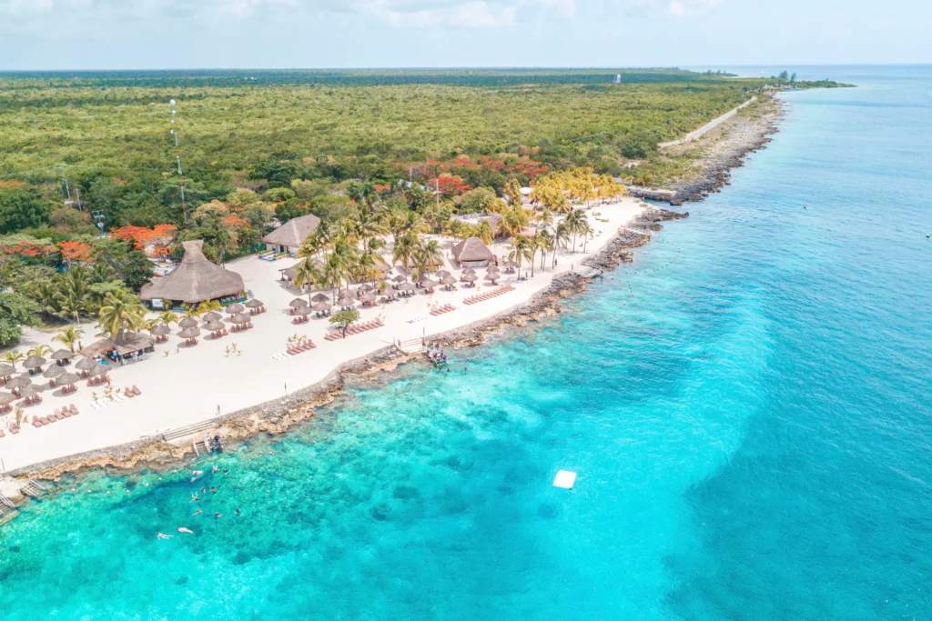 Aerial view of a beautiful coastline with sandy beaches and clear turquoise waters in Cozumel, Mexico