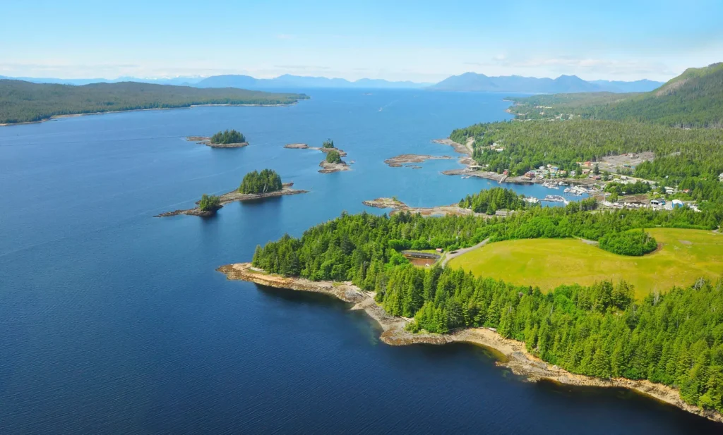 Aerial view of a picturesque fjord in Ketchikan, Alaska, showcasing the coastline and lush vegetation