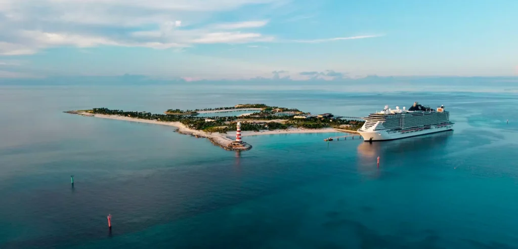 Aerial view of MSC Seashore docked at Ocean Cay MSC Marine Reserve in the Bahamas, surrounded by tranquil blue waters