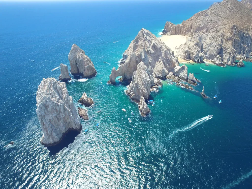 Aerial view of the stunning Cabo San Lucas coastline with unique rock formations and turquoise waters