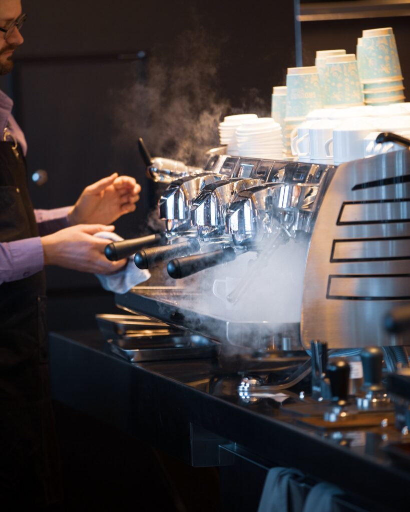 Barista pulling espresso aboard Virgin Voyages