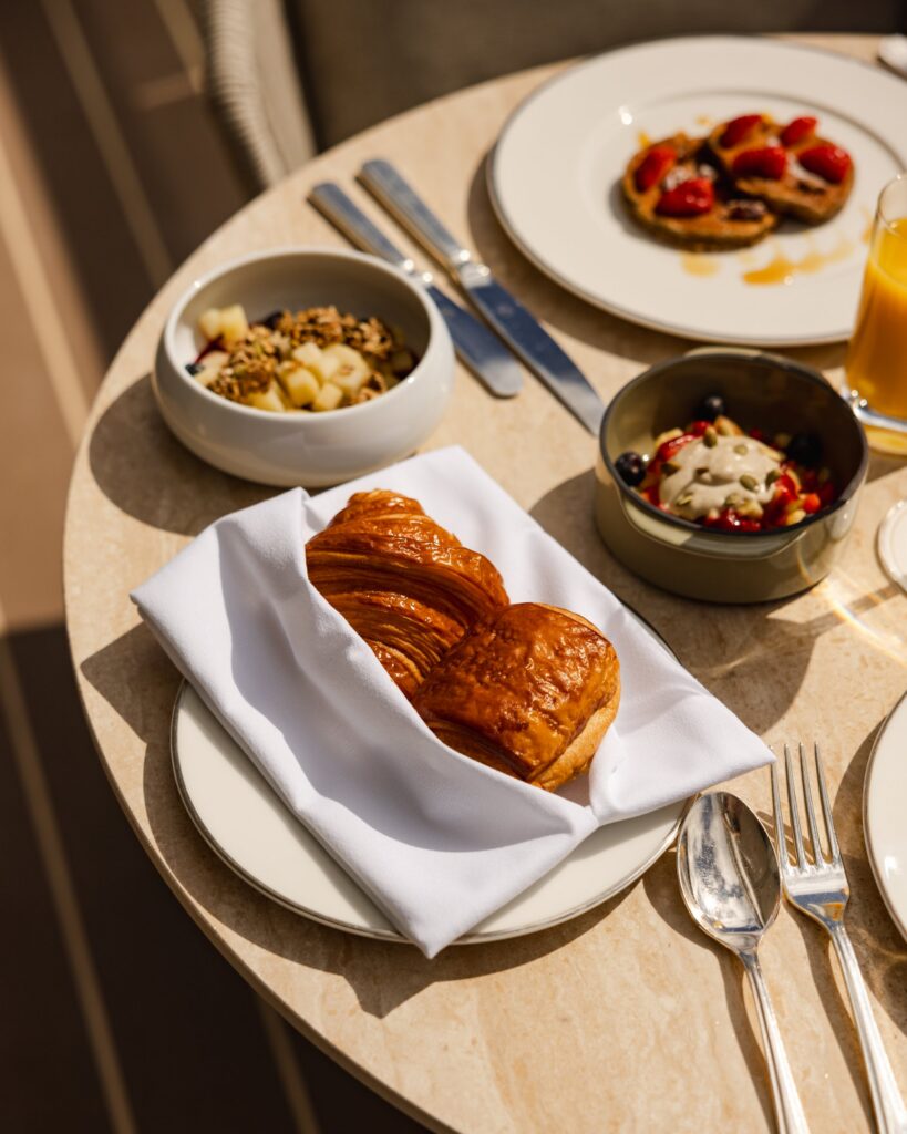 Breakfast pastries and fresh fruit aboard Explora Journeys