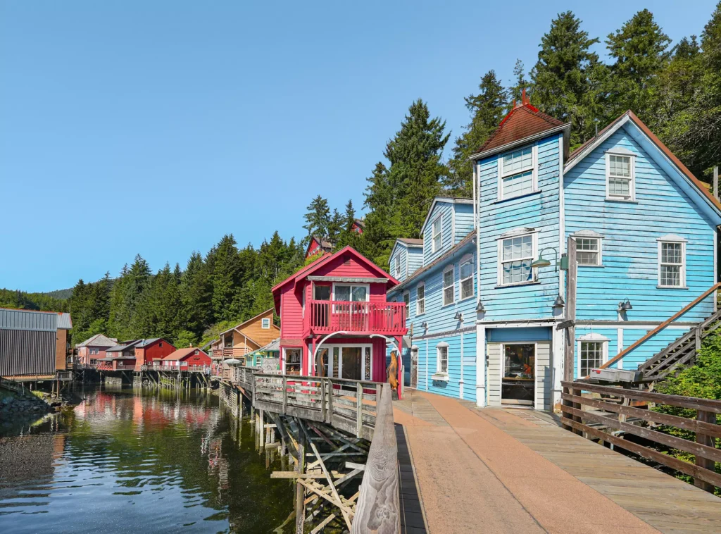 Charming buildings line the boardwalk along a tranquil creek in Ketchikan, Alaska