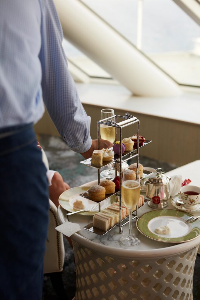 Afternoon tea service with pastries and finger sandwiches aboard Crystal