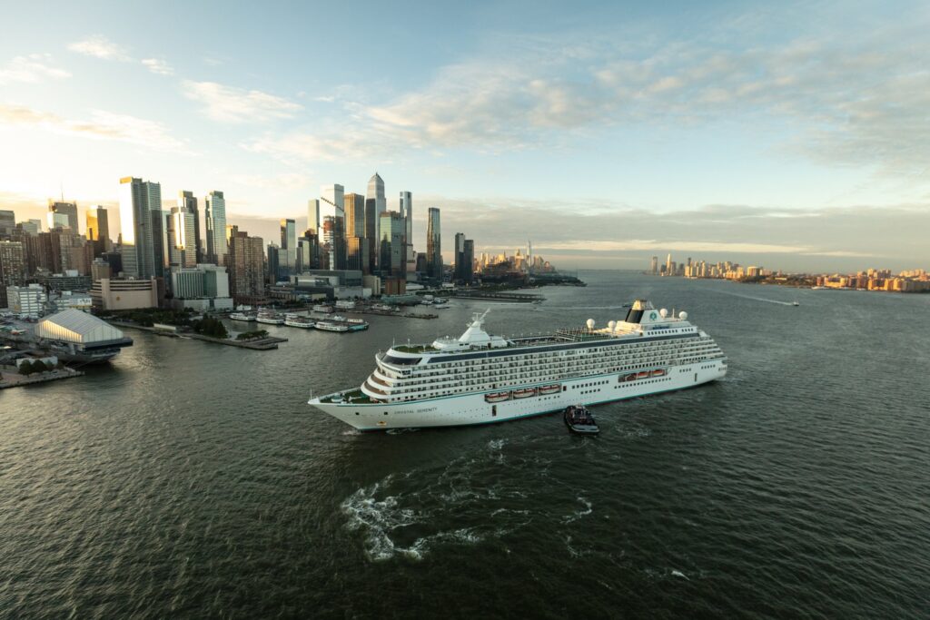 Crystal cruise ship sailing past the Manhattan skyline in New York Harbor