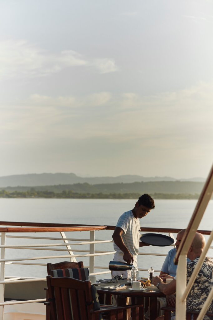 Guest enjoying the sea view from the deck of a Crystal ship
