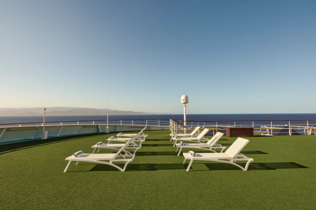 Observation Deck aboard Crystal with lounge chairs and open sea views