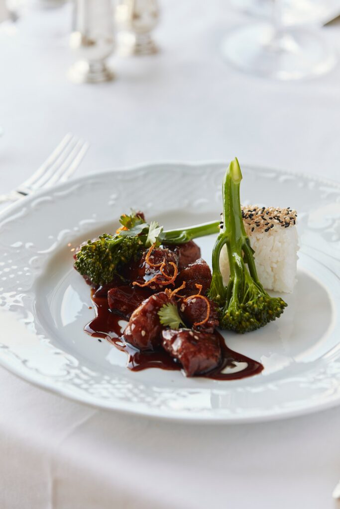 Plated main course served in Waterside restaurant aboard Crystal
