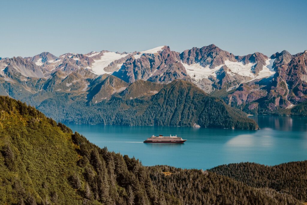 Explora III in an Alaska fjord surrounded by mountains