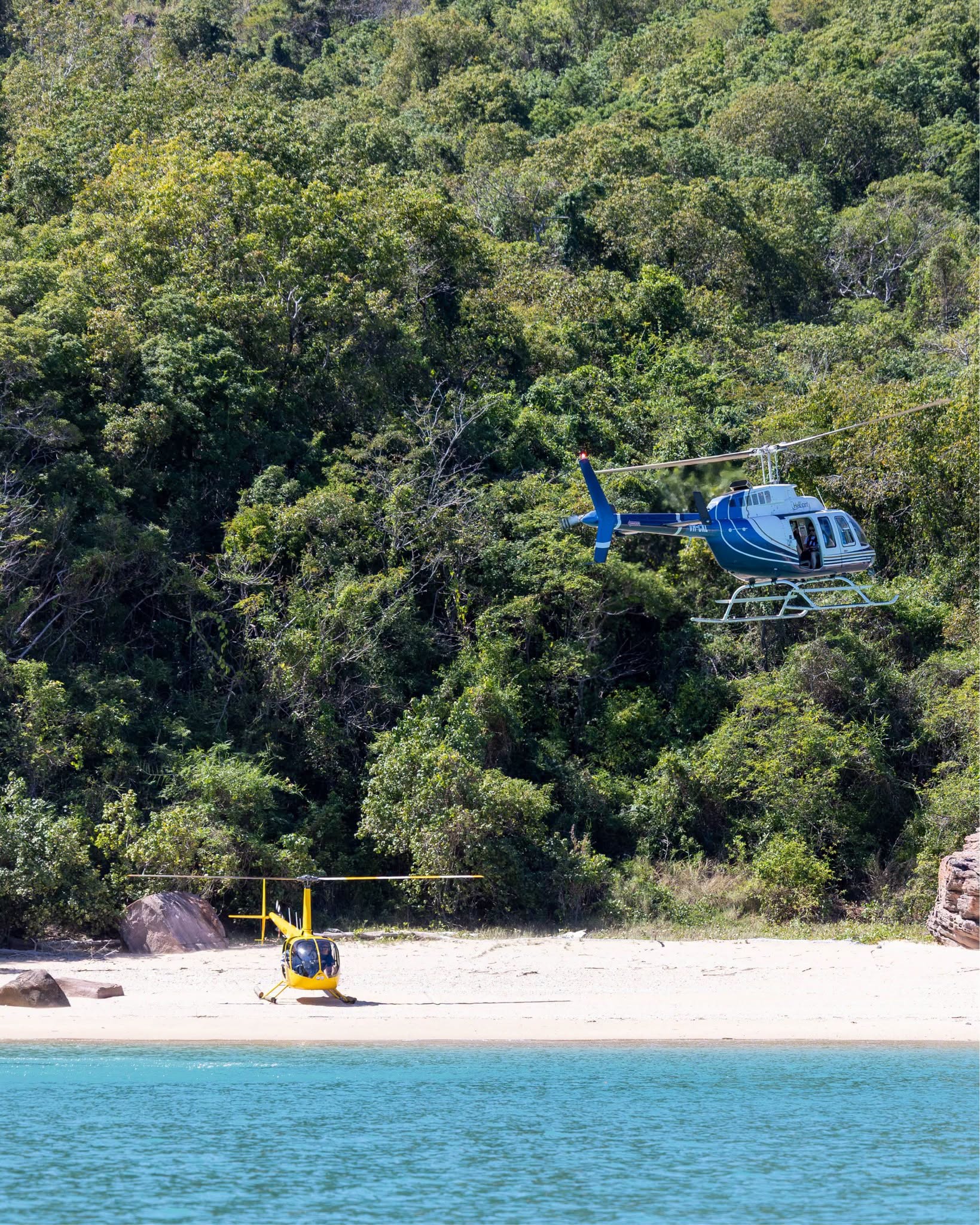 Helicopter tour landing near a tropical beach