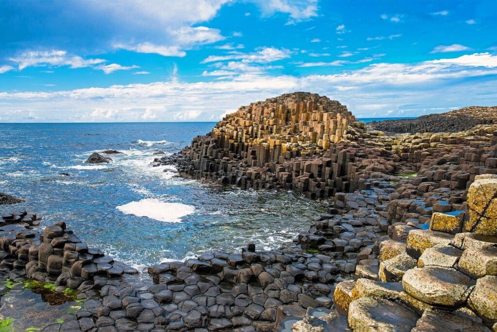 Hexagonal basalt columns on a rugged Atlantic coastline