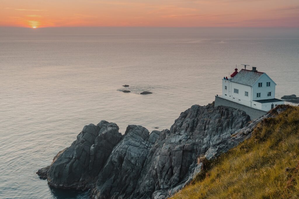 Lighthouse on the rocky coast of Måløy, Norway