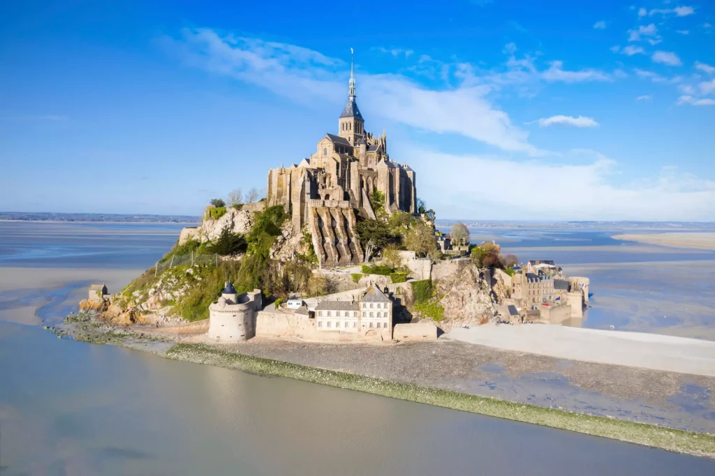 Mont-Saint-Michel rising from the sea at low tide
