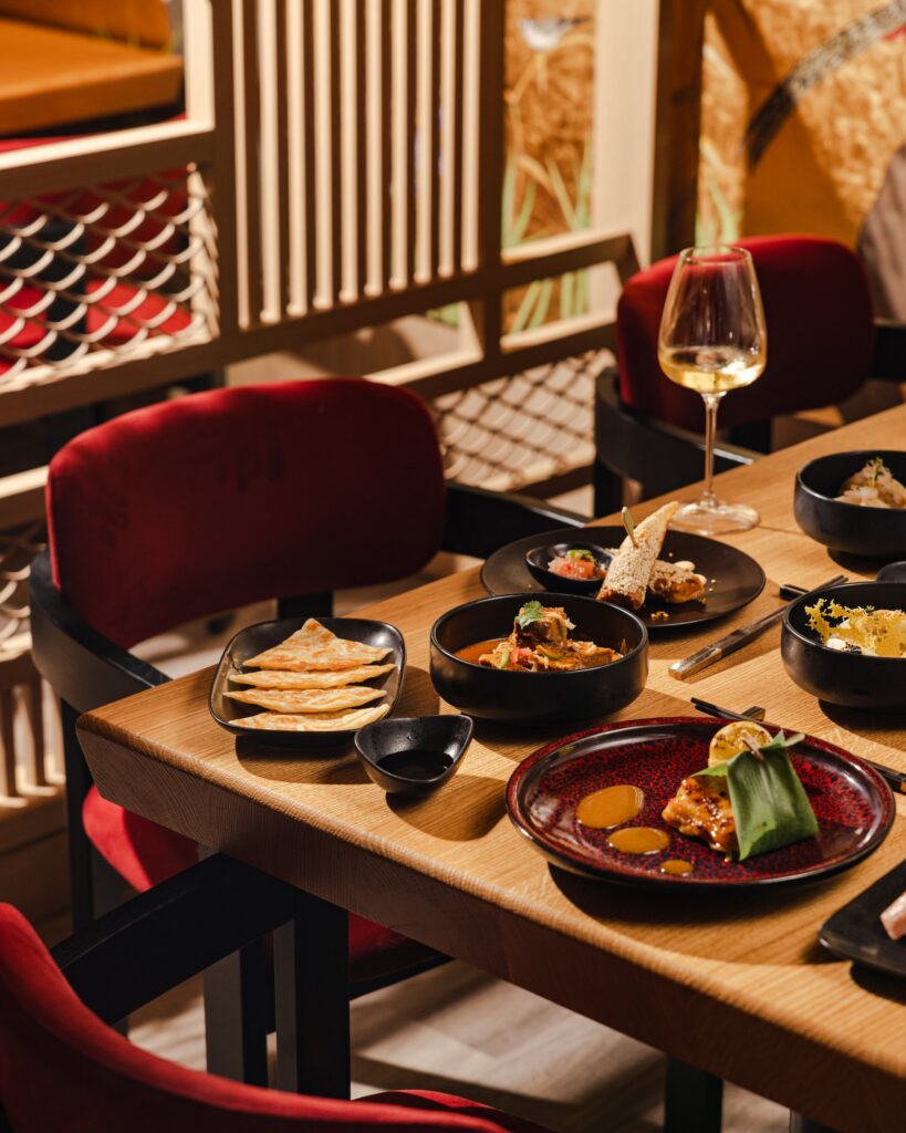 Shared plates and wine at an Explora Journeys restaurant