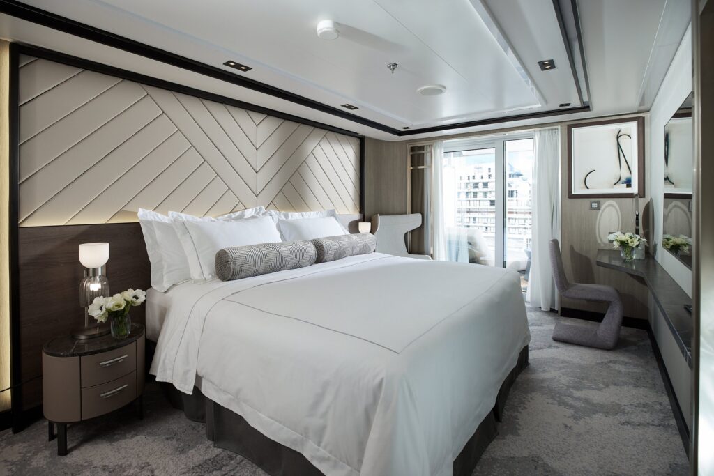 Suite bedroom with ocean view aboard Regent Seven Seas Grandeur