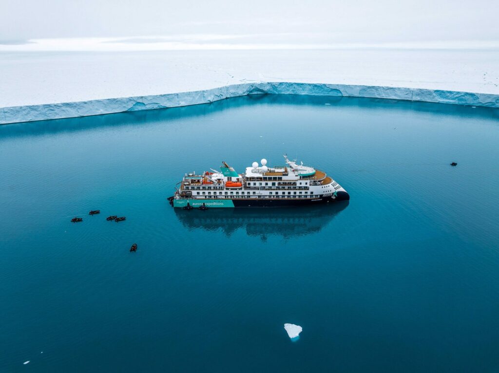 Sylvia Earle expedition ship beside a glacier front in Svalbard