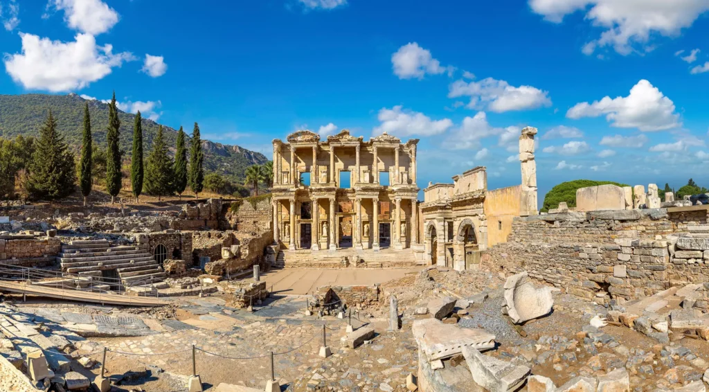 The ancient ruins of Ephesus under a bright blue sky in Turkey