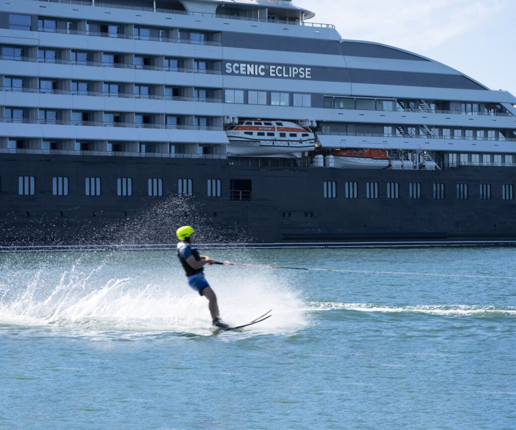 Water skiing behind Scenic Eclipse