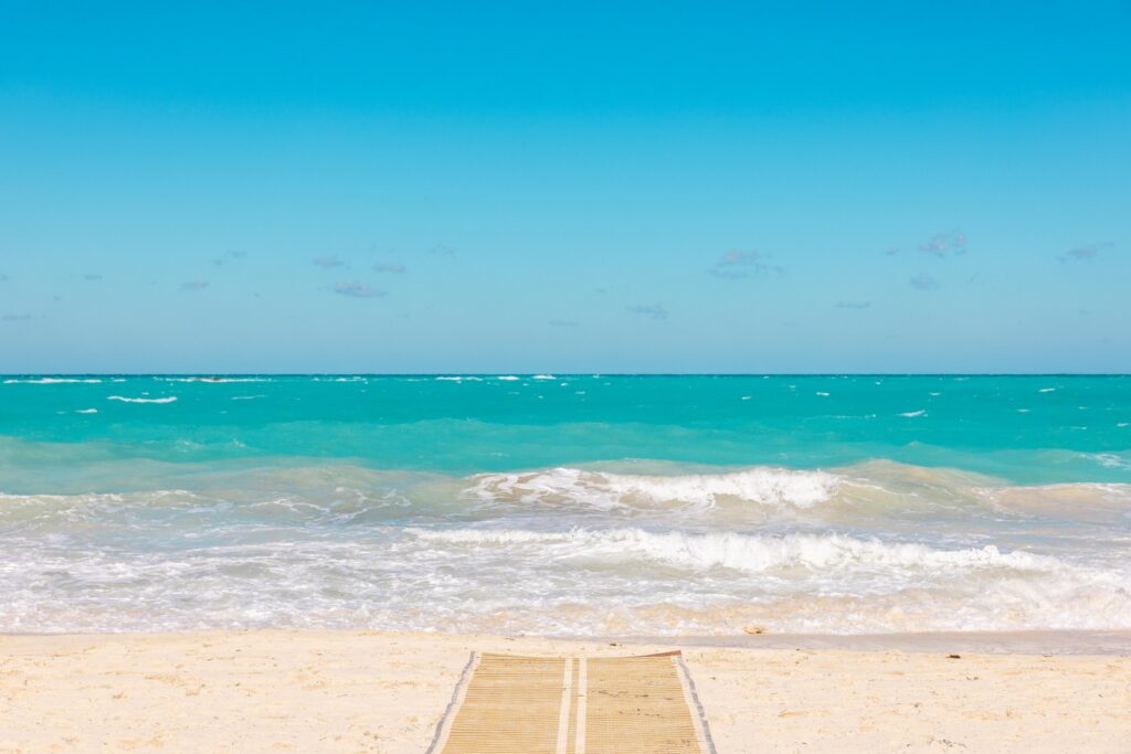 White sand beach and calm water at Bimini Beach Club, Bahamas