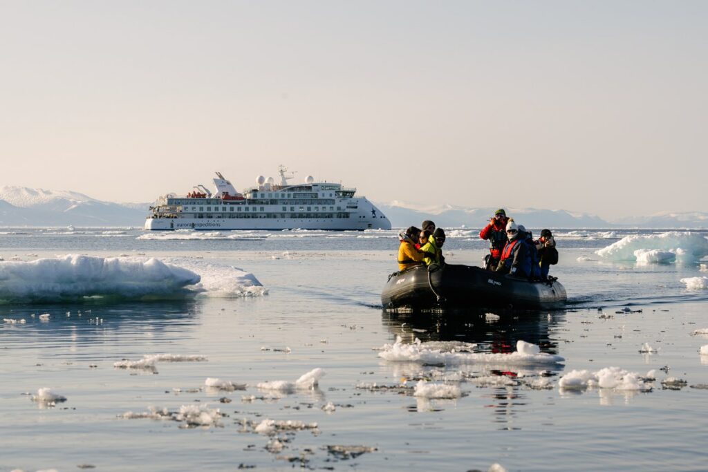Zodiac cruising among sea ice in Svalbard